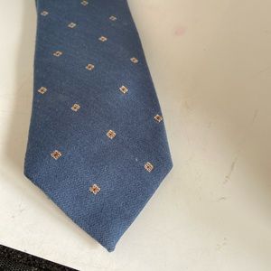 Arnie tie blue & tiny white and red. 56” long Could it be Arnie Palmer?